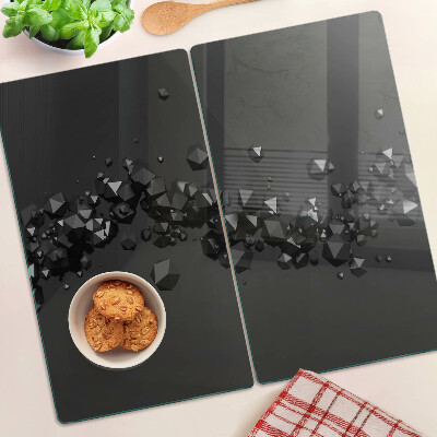 Glasschneidebrett Schwarze Kristalle auf dem Hintergrund