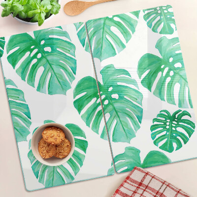 Glasschneidebrett Monstera-Blätter auf weißem Hintergrund
