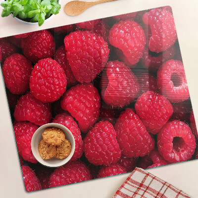 Schneidebrett glas Himbeeren auf dem Hintergrund
