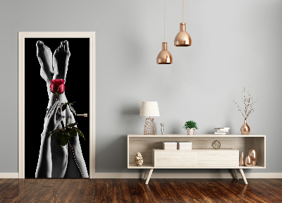 Selbstklebendes wandbild an der wand Rose und füße