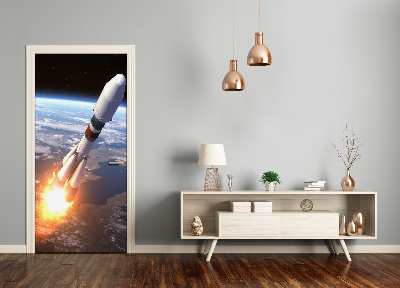 Selbstklebendes wandbild an der wand Eine weltraumrakete