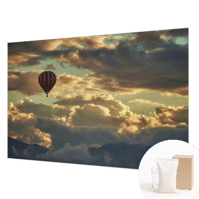 Fototapete mit einem Heißluftballon in den Wolken