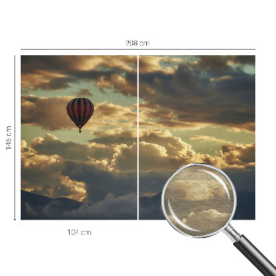 Fototapete mit einem Heißluftballon in den Wolken