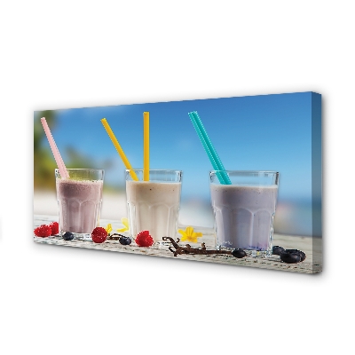 Leinwandbilder Glas Strohhalme mit farbigem Cocktail