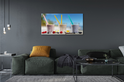 Leinwandbilder Glas Strohhalme mit farbigem Cocktail