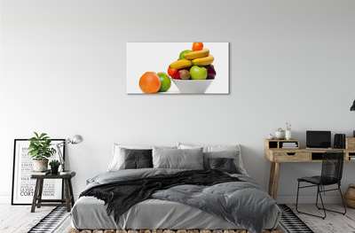 Leinwandbilder Obst in eine Schüssel geben