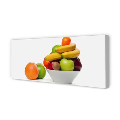 Leinwandbilder Obst in eine Schüssel geben