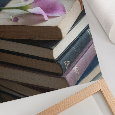 Kunstdruck leinwand Ein Bücherstapel mit einer zarten Blume darauf.