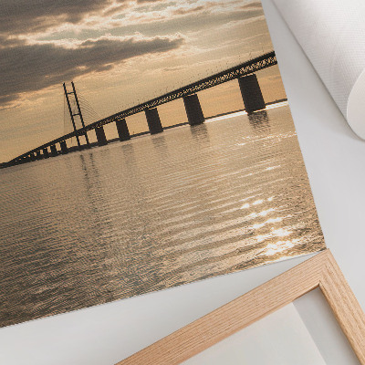 Kunstdruck leinwand Eine Brücke über das Wasser im Licht der untergehenden Sonne