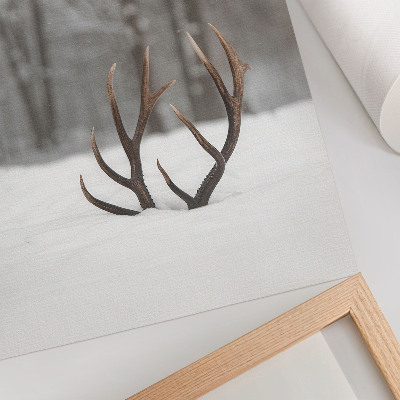 Wandposter Winterlandschaft mit Geweihen im Schnee