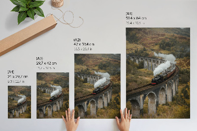Kunstdruck leinwand Ein Zug auf einer Brücke inmitten grüner Hügel