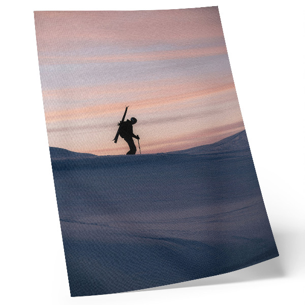 Kunstdruck leinwand Skifahrer vor rosa Himmel in einer Winterlandschaft