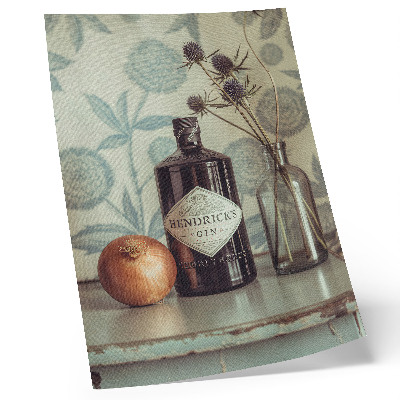 Kunstdruck leinwand Eine Flasche mit einem Blumenmuster im Hintergrund