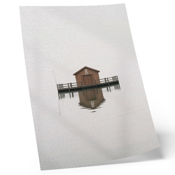 Wandposter Ein minimalistisches Holzhäuschen am Wasser