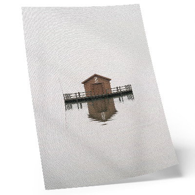 Wandposter Ein minimalistisches Holzhäuschen am Wasser