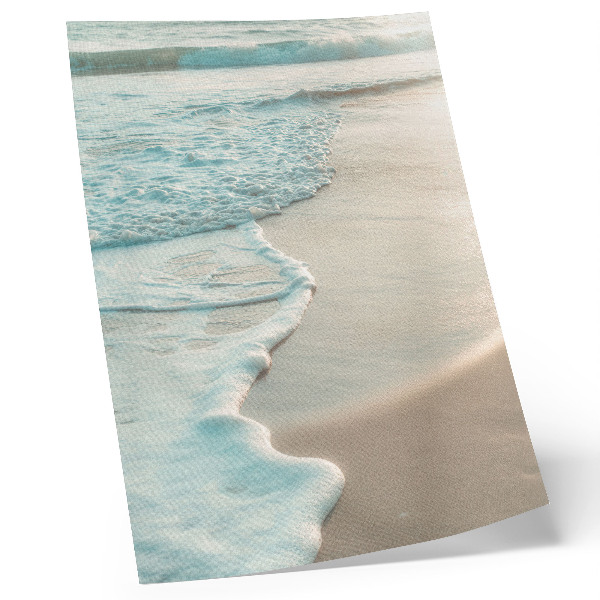 Kunstdruck leinwand Sanfte Wellen plätschern an den Sand, eine ruhige Atmosphäre