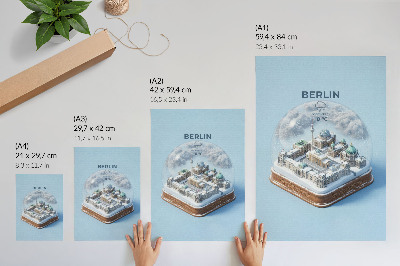Wandposter Eine Miniaturstadt in einer gläsernen Schneekugel