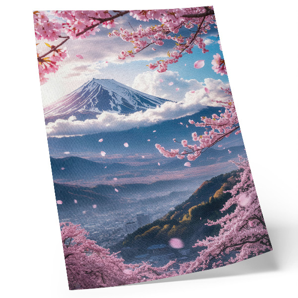 Poster Berge und blühende Kirschbäume vor einem rosa Himmel