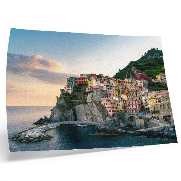 Kunstdruck poster Bunte Häuser auf einer Klippe über dem Meer