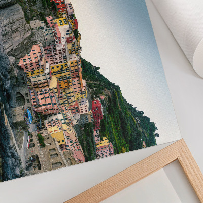 Kunstdruck poster Bunte Häuser auf einer Klippe über dem Meer
