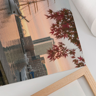 Poster Ein Segelschiff im Sonnenuntergang, ein friedliches Panorama der Stadt