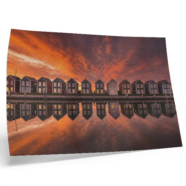Poster Bunte Häuser am Wasser im Licht der Abenddämmerung