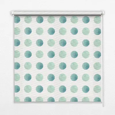 Fensterrollo mit türkisfarbenem Punktemuster auf weißem Hintergrund