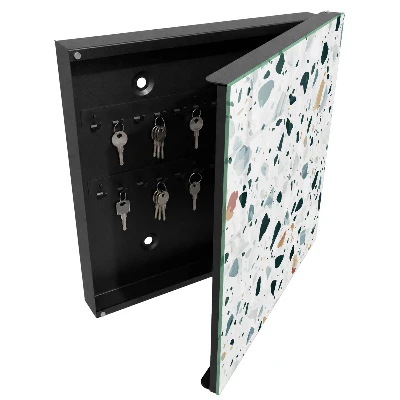 Schlüsselschrank mit bunten Kieselsteinen