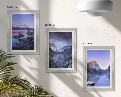 Bilderwand mit Berglandschaften in der Abenddämmerung und Ausblicken aufs Wasser