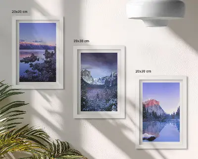 Bilderwand mit Berglandschaften in der Abenddämmerung und Ausblicken aufs Wasser