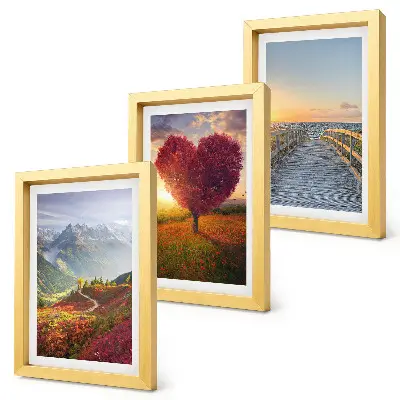 Bilderwand mit Berglandschaften und herzförmigem Baumsteg