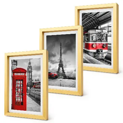 Bilderwand mit Motiven von ikonischen Städten wie London und Paris sowie Schienenverkehr
