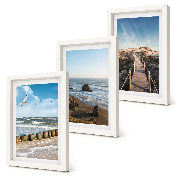 Fotowand Blick auf den Strand mit Wellen, Himmel und einer Strandpromenade