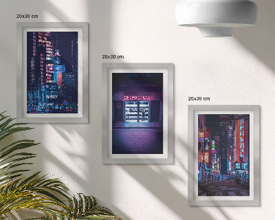 Bilderwand Nachtstadt mit Neonlichtern und einem Kinoeingang