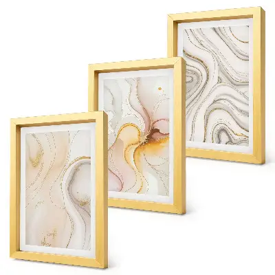 Bilderwand mit abstrakten, warmen Mustern und eleganten Motiven