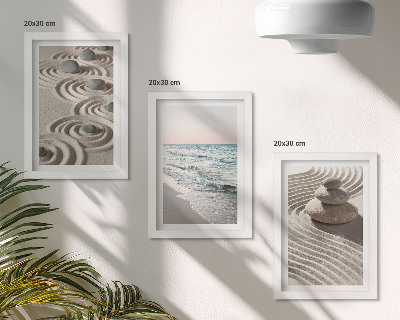 Fotowand Ruhige Wellen aus Sand und Wasser mit Steinen am Strand