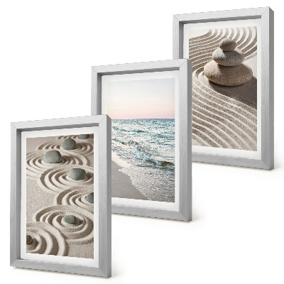 Fotowand Ruhige Wellen aus Sand und Wasser mit Steinen am Strand