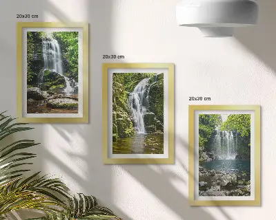 Bilderwand mit Wasserfällen in grüner Umgebung zwischen Steinen und Wasser