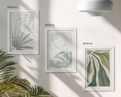 Bilderwand mit Pflanzenblättern in Grün- und Grautönen