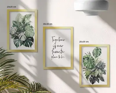 Bilderwand mit Motiv von grünen Tropenblättern und dekorativem Schriftzug
