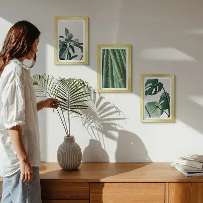 Fotowand mit Bambusstängeln Zimmerpflanze und Monstera-Blättern
