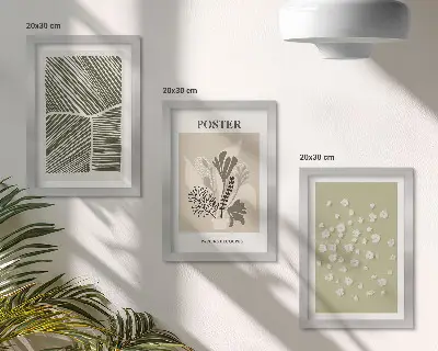 Bilderwand mit Pflanzenmotiven in gedeckten Farben und Mustern