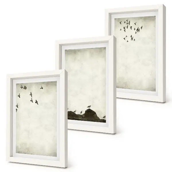 Bilderwand mit fliegender Vogelschar im minimalistischen Stil
