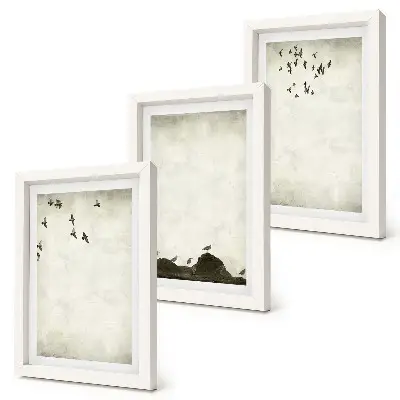 Bilderwand mit fliegender Vogelschar im minimalistischen Stil