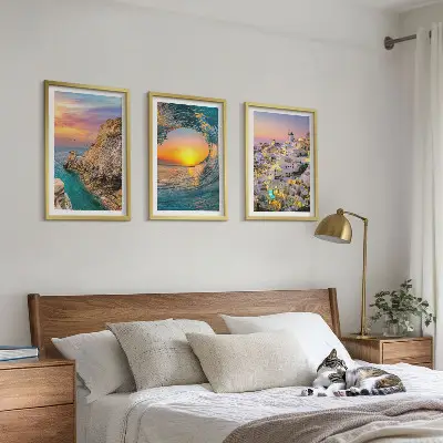 Bilder-3er-Set mit Rahmen Meereswellen und weiße Häuser auf Santorini