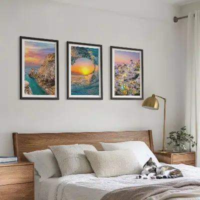 Bilder-3er-Set mit Rahmen Meereswellen und weiße Häuser auf Santorini