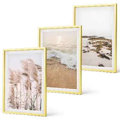Gerahmtes Bilderset mit Strandgras, Wellen und Steinen im Boho-Stil