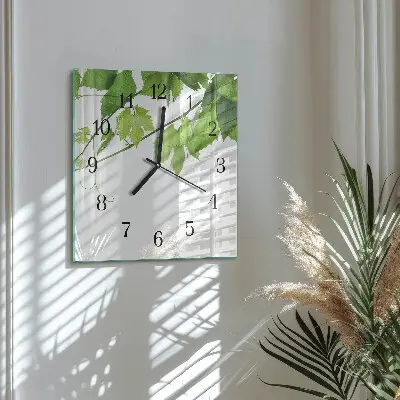 Quadratische wanduhr modern Blätter