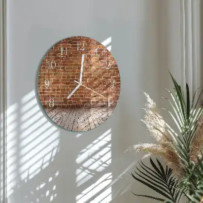Runde wanduhr aus glas Ziegelmauer