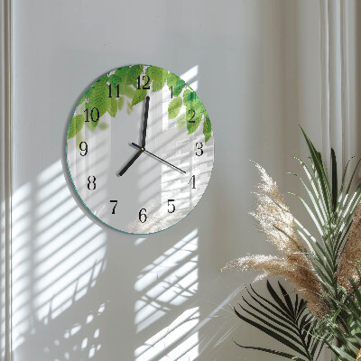 Runde wanduhr aus glas Blätter